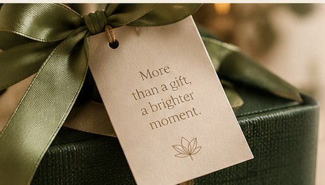 Deep green gift box with elegant ribbon and handwritten-style gift tag